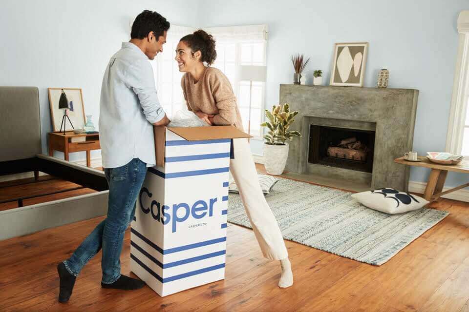 Man and woman with a Casper box