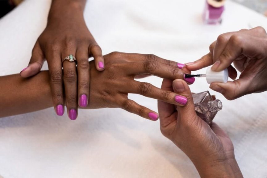 Woman getting nails painted