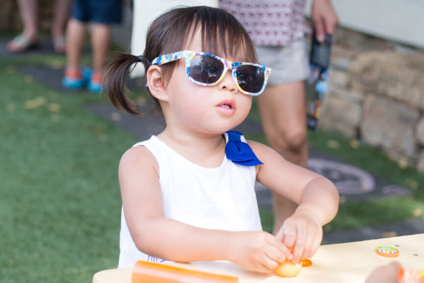 A child wearing sunglasses